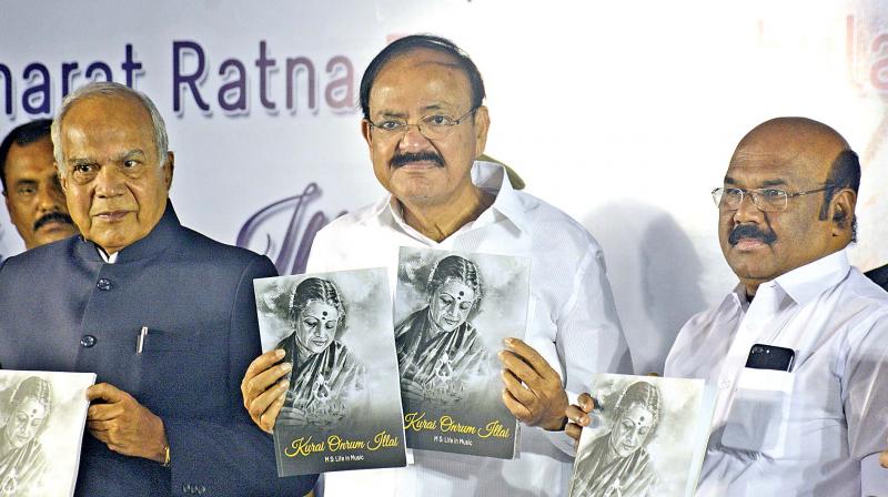Vice President M. Venkaiah Naidu releases a book, Kurai Ondrum Illai, MS: Life in Music, on Tuesday. Governor Banwarilal Purohit and State Fisheries Minister  D. Jayakumar are also seen (Photo: DC)