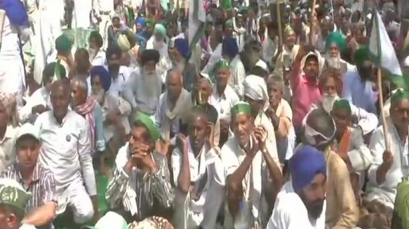 Protesting under the banner Bharatiya Kisan Union, scores of farmers reached Parliament Street and raised slogans in support of their demands. (Photo: ANI)
