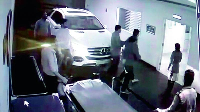 CCTV footage shows two people accompanying Mustafa into the hospital after the alleged firing on Friday. (Photo:DC)