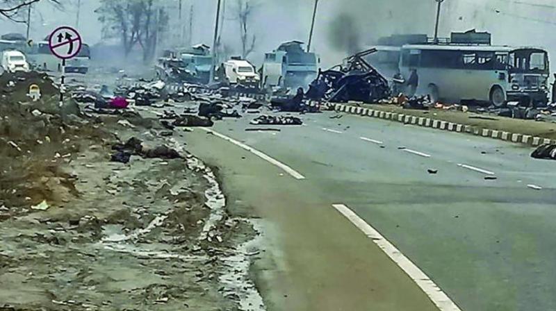 A scene of the spot after militants attacked a CRPF convoy in Goripora area of Awantipora town in Pulwama district of J&K on Thursday. At least 49 CRPF jawans were killed in the attack. (Photo: PTI)