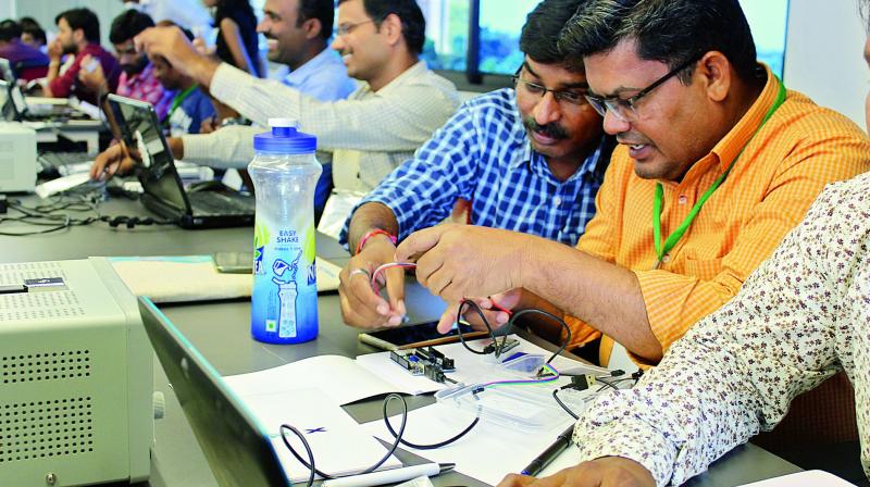 Participants work on  prototypes during the first IoT Hackathon.