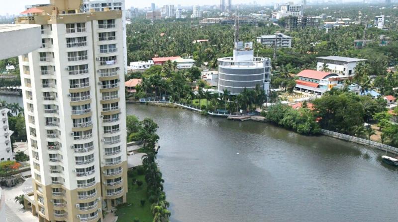 Mapping of river bank structures is one of the parameters that must be incorporated into computer models to prepare simulation models. One of the five buildings the Supreme Court has ordered to demolish for violating coastal zone regulations in Kochi. (Photo: DC)