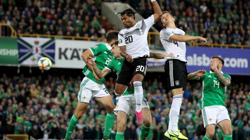 Germany keep Ireland at bay to top group after 2-0 root