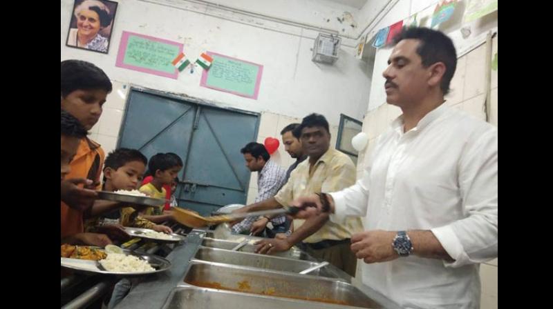 UPA chairperson Sonia Gandhis son-in-law Robert Vadra kickstarted his birthday week celebrations at an NGO where he spent time with children, the elderly and the poor, among others. (Photo: ANI)