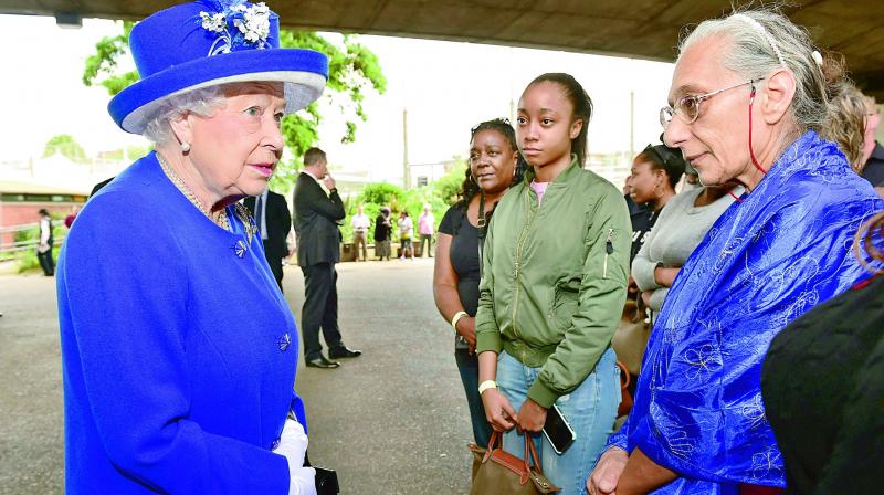 Britains Queen Elizabeth II meets members of the community affected by the fire at Grenfell Tower in west London. (Photto:AP)