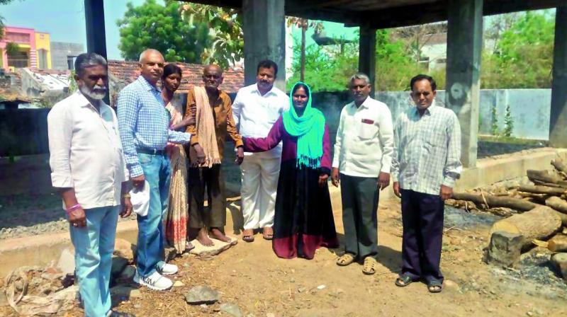 Locals hand over Adepu Ramanatham to the caretakers of Sahrudaya orphanage for the elderly on Thursday. (Photo: DC)