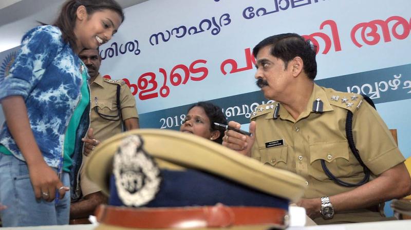 Kochi city Police Commissioner MP Dinesh hearing petition from a school student during an adalath at Kadavanthra child-friendly police station in Kochi on Tuesday. 	 (Photo: SUNOJ NINAN MATHEW)