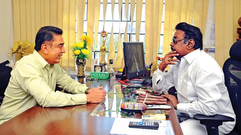 Actor-politician Kamal Haasan meets DMDK party founder Vijayakanth at his office on Monday.