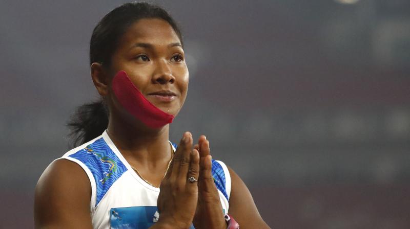 In Jakarta Swapna Barman won her specialist high jump, the shot put and javelin, to record a personal best score of 6,026. Besides her shoe woes, Barman also had to contend with a toothache and ran with a taped jaw. (Photo: AP)