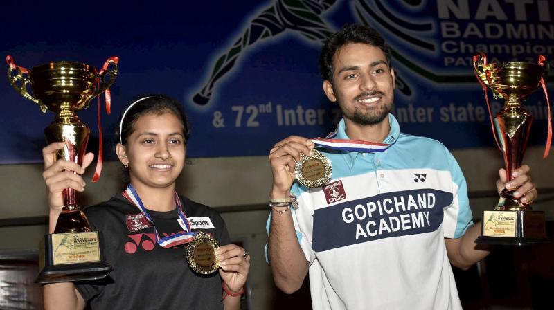 Rituparna Das and Sourabh Verma with their national singles titles. (Photo: PTI)