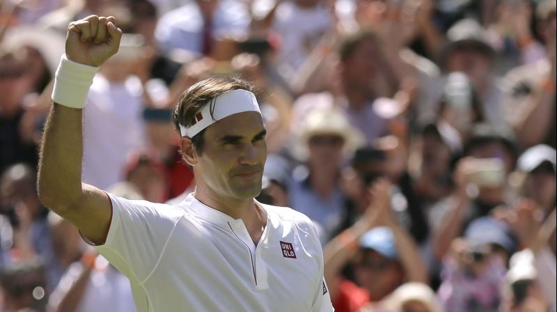 Roger Federer gave his headband to a young female fan in the crowd after completing a straight-sets win in the first round of Wimbledon 2018. (Photo: )