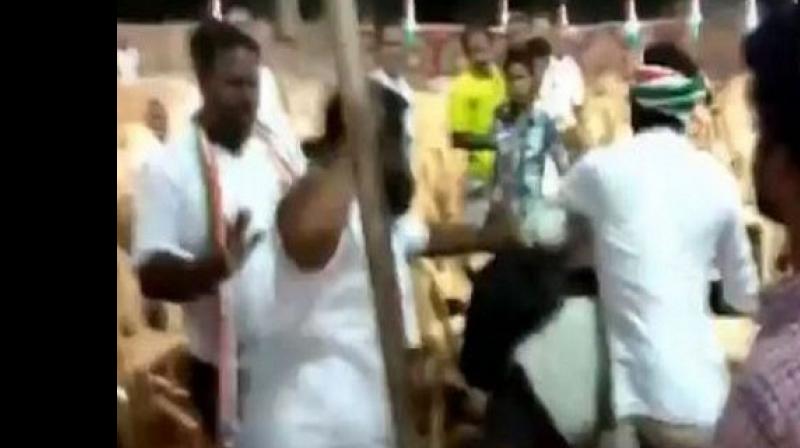 Enraged with the lensmen, a few congress party workers misbehaved with photojournalists and began to thrash them. (Photo: ANI)