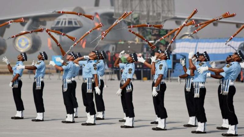 IAF personnel perform with their guns during the full dress rehearsal for the Air Force Day function. (Photo: PTI)