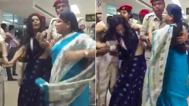 Footage from the Silchar airport shows women lawmakers in the Trinamool delegation running as they were chased and restrained by policewomen. (Photo: PTI)