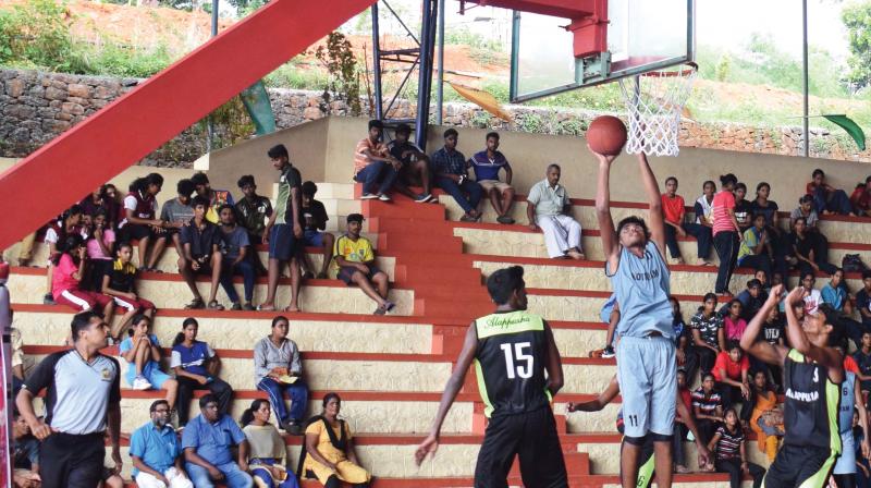 Sajeesh scores for Kottayam against Alappuzha in a boys group match in the state junior basketball  championship at Thodupuzha.