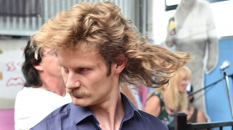 A man shows off his mullet haircut at Mulletfest 2018 in the town of Kurri Kurri, 150 kms north of Sydney on February 24, 2018. (Photo: AFP)