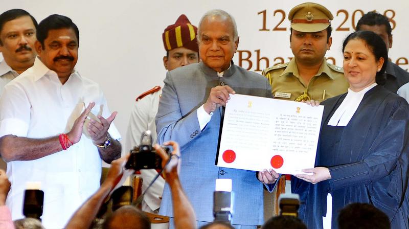 Governor Banwarilal Purohit and the new Chief Justice of Madras high court Vijaya Kamlesh Tahilramani with the latters Warrant of Appointment during the swearing-in ceremony in Raj Bhavan on Sunday. Also seen is Chief Minister Edappadi K. Palaniswami.  (Photo:DC)