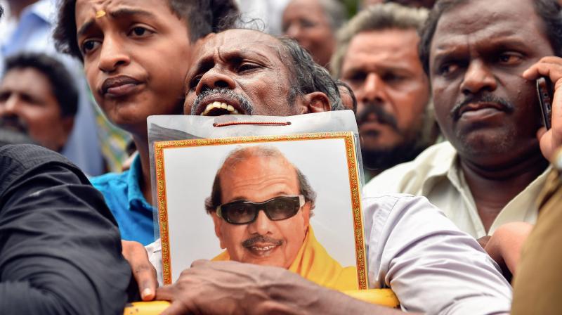 A Dravida Munnetra Kazhagam (DMK) supporter reacts to a bulletin that was released about party president M Karunanidhis health, in Chennai on Monday. (Photo: PTI)
