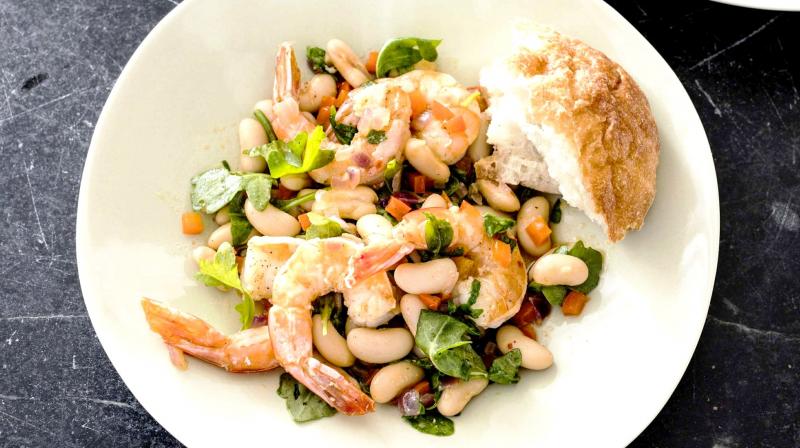 Traditional dish with a twist: shrimps with white beans