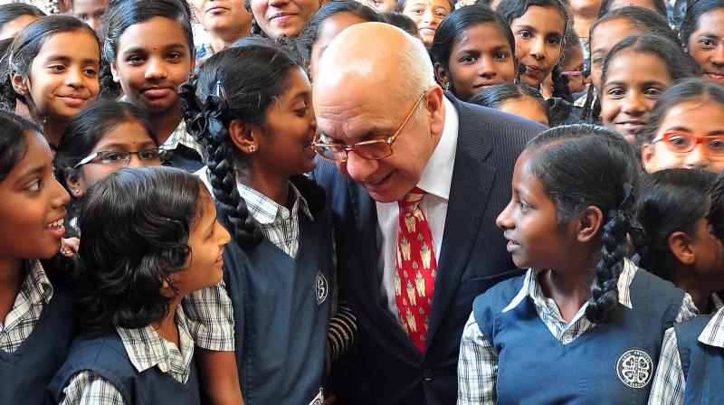 Virendra Sharma, U.K. MP, interacts with schoolchildren in Bengaluru on Thursday.
