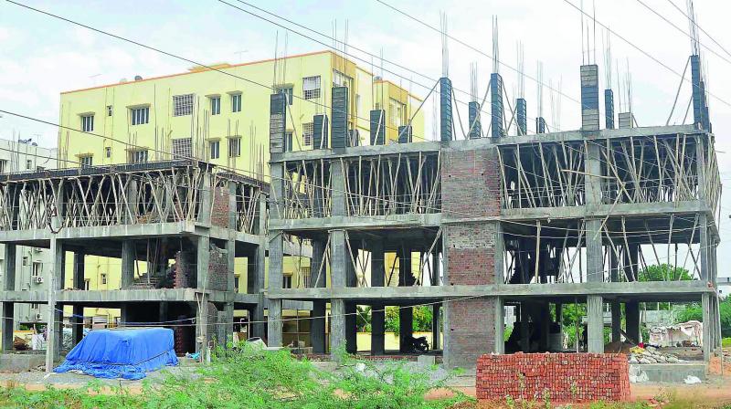 The multiple floored construction stopped in the middle due to slump in the realty sector as there is abnormal hike of cement and steel prices. (Photo: DC)