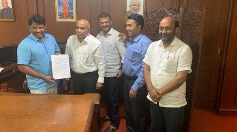 Legislators Manohar Ajgaonkar and Dipak Pawaskar gave a letter to merge the MGP legislature party with the BJP to officiating Goa Assembly Speaker Michael Lobo at 1:45 am. (Photo: ANI)