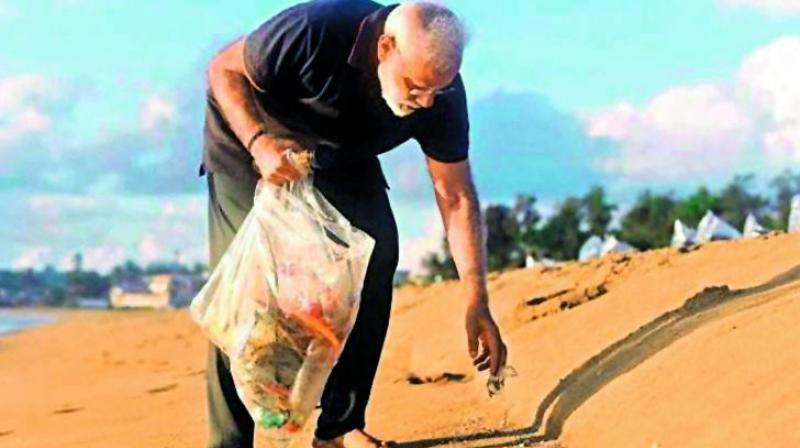 Prime Minister Narendra Modi plogging at the Mamallapuram beach.