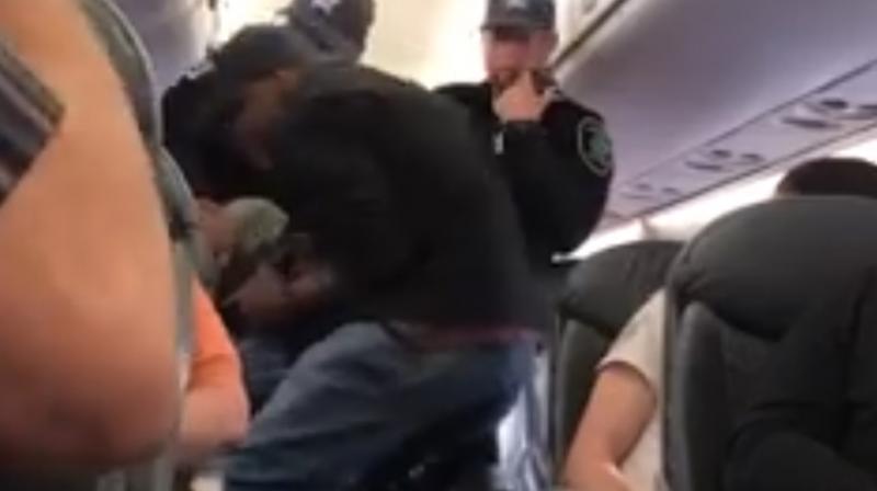United said airline representatives chose four passengers at random when no volunteers agreed to leave the overbooked flight. (Photo: Screengrab)