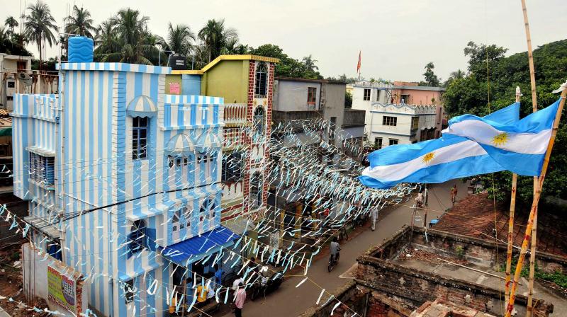 But when a Kolkata-based travel agent informed him that his savings  a princely amount of â‚¹60,000  are not enough to fund his World Cup trip, he decided the next best thing  paint his entire three-storey building in Argentina colours. (Photo: PTI)