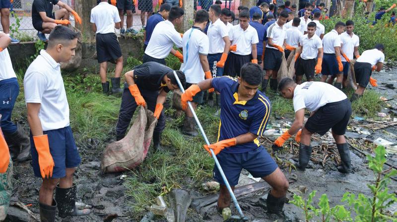 Navy officers clean up Venduruthy Channel