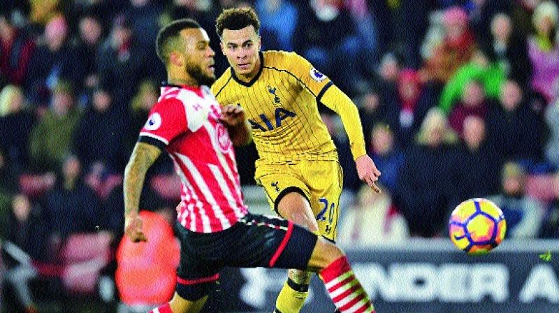 Tottenham Hotspurs Dele Alli (right) scores against Southampton in their EPL match at St Marys Stadium in Southampton on Wednesday. The visitors won 4-1.	(Photo: AFP)