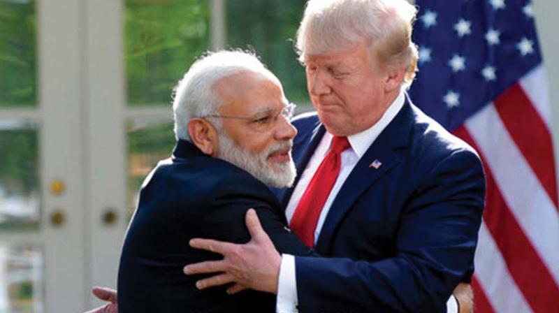 Prime Minister Narendra Modi embraces U.S President Donald Trump.