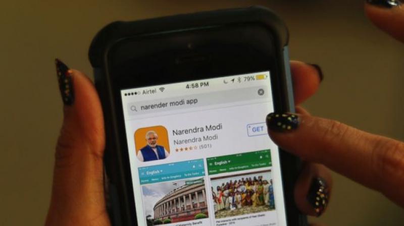 An Indian woman about to download Indian Prime Minister Narendra Modis official smartphone app in New Delhi, India, Monday, March 26, 2018. (Photo: AP)