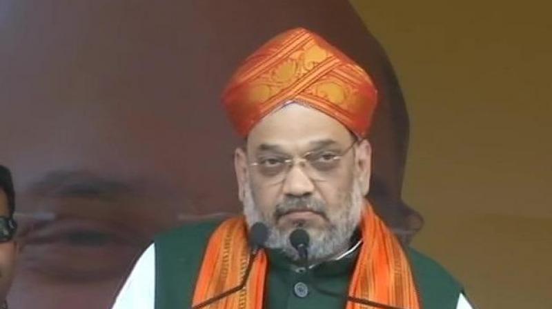 Amit Shah holds massive road show in Tumkur on last day of campaining