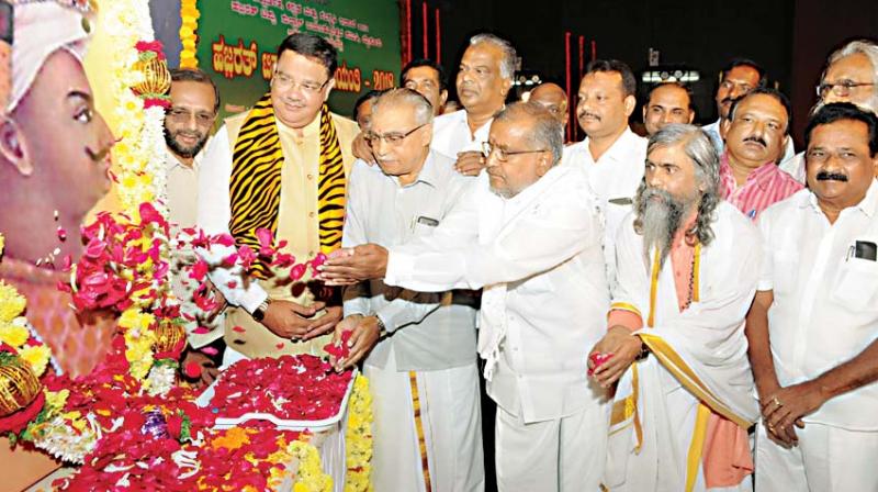 Minister G.T. Deve Gowda  and senior Congress leader Tanveer Sait participate in Tipu Jayanti celebrations in Mysuru on Saturday (Photo:  KPM)