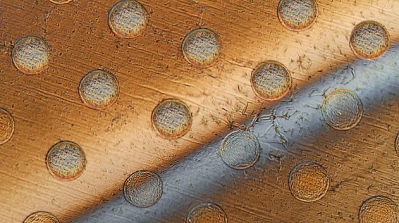 The key to making such tiny devices, which the team calls \syncells\ (short for synthetic cells), in large quantities lies in controlling the natural fracturing process of atomically-thin, brittle materials. (Image: Felice Frankel / Via: MIT News)