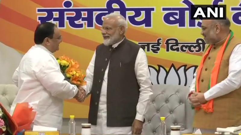 Prime Minister Narendra Modi and other senior BJP leaders presented bouquets to JP Nadda at the BJP Parliamentary Board meeting which was held at the BJP headquarters. (Photo: ANI)