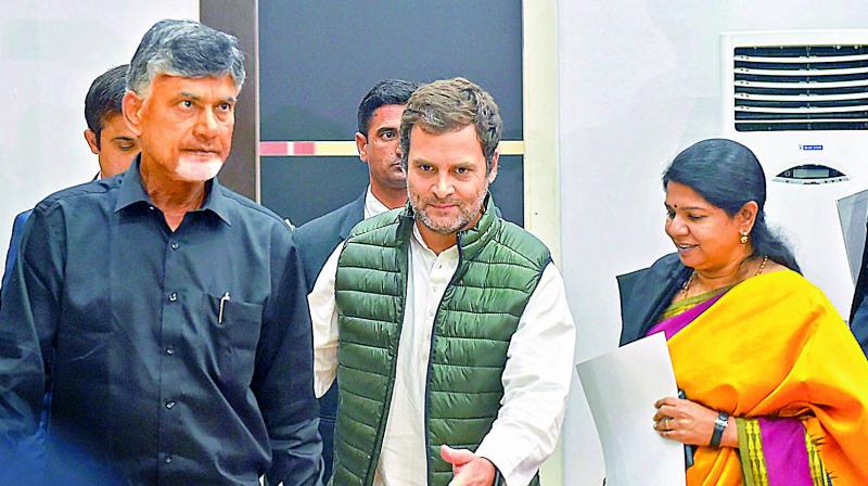 Congress chief Rahul Gandhi with TD chief N. Chandrababu Naidu, CPIs D Raja and DMK leader Kanimozhi leave after a press conference following the Opposition parties meeting over various political issues including the issue of EVMs, in New Delhi on Friday. Naidu shed his trademark light gold coloured outfit and wore a black shirt and white trouser to protest the Centres  apathetic attitude  towards the state.  (PTI)