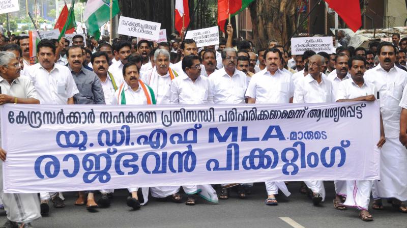 UDF MLAs stage a march to Raj Bhavan to protest against the Central governments bid to destroy the cooperative sector in the state on Monday. (Photo: DC)