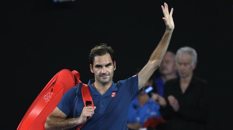 Switzerlands Roger Federer waves as he leaves Rod Laver Arena after losing his fourth round match against Greeces Stefanos Tsitsipas at Australian Open tennis championships in Melbourne. (Photo: AP)