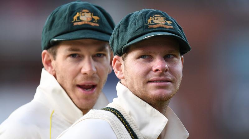 Australias captain Tim Paine and Steve Smith celebrate their victory after the fourth Ashes cricket Test match between England and Australia at Old Trafford in Manchester.  Australia retained the Ashes with a 185-run thrashing of England in the fourth Test at Old Trafford on Sunday. (Photo:AFP)