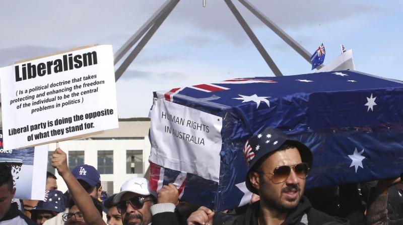 Hundreds of refugees protest outside Australian Parliament
