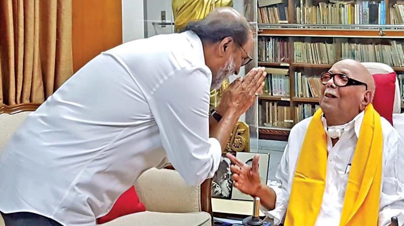 Rajinikanth calls on DMK president M.K. Karunanidhi.