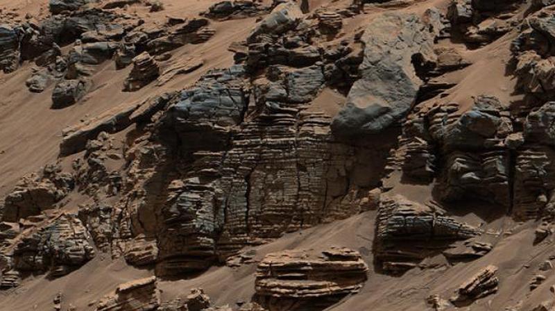 This evenly layered rock imaged in 2014 by the Mastcam on NASAs Curiosity Mars rover shows a pattern typical of a lake-floor sedimentary deposit near where flowing water entered a lake. Shallow and deep parts of an ancient Martian lake left different clues in mudstone formed from lakebed deposits. (Credit: NASA/JPL-Caltech/MSSS)