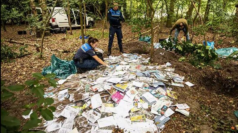 Thousands of letters found buried in holes in Dutch forest