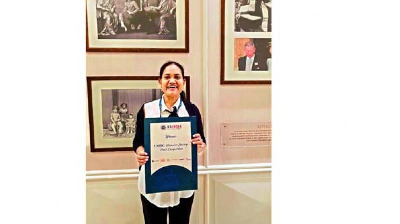 Subalakshmi Krishnamurthy with the Womens Startup Pitch Competition award
