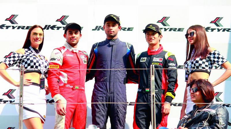 Winner Anindith Reddy celebrates on the podium with Nayan Chatterjee and Akhil Rabindra. (Photo: DC)