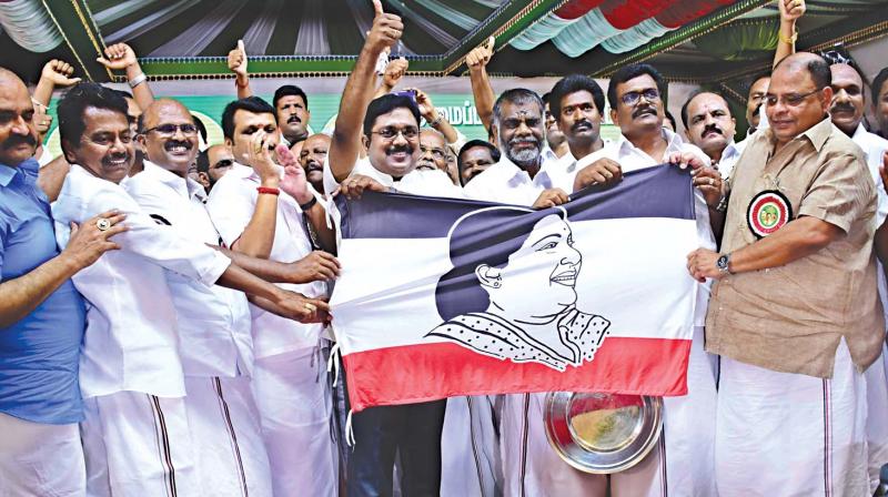 RK Nagar MLA T.T.V. Dhinakaran showing his new party flag in Melur, in Madurai district, on Thursday. (Photo: K. Manikandan)
