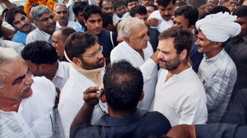 Congress vice-president Rahul Gandhi attends the cremation ceremony of ex-serviceman Ram Kishan Grewal at hius village Bamla in Bhiwani, Haryana on Thursday. (Photo: PTI)
