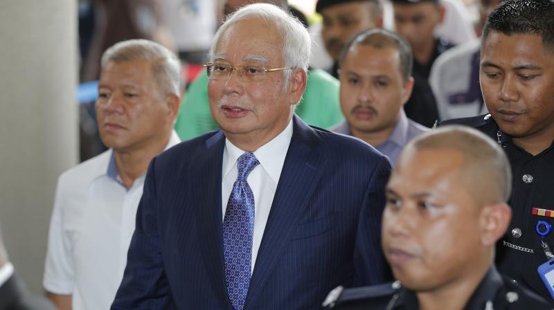 Former Malaysia PM Najib Razak pleads not guilty as corruption trial starts